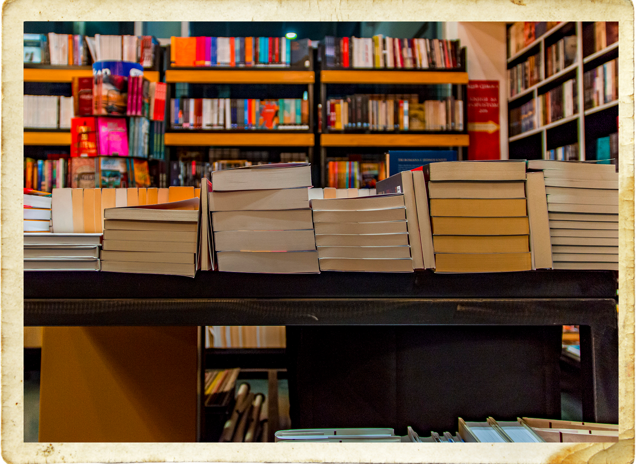 Stacks of books in a bookstore.