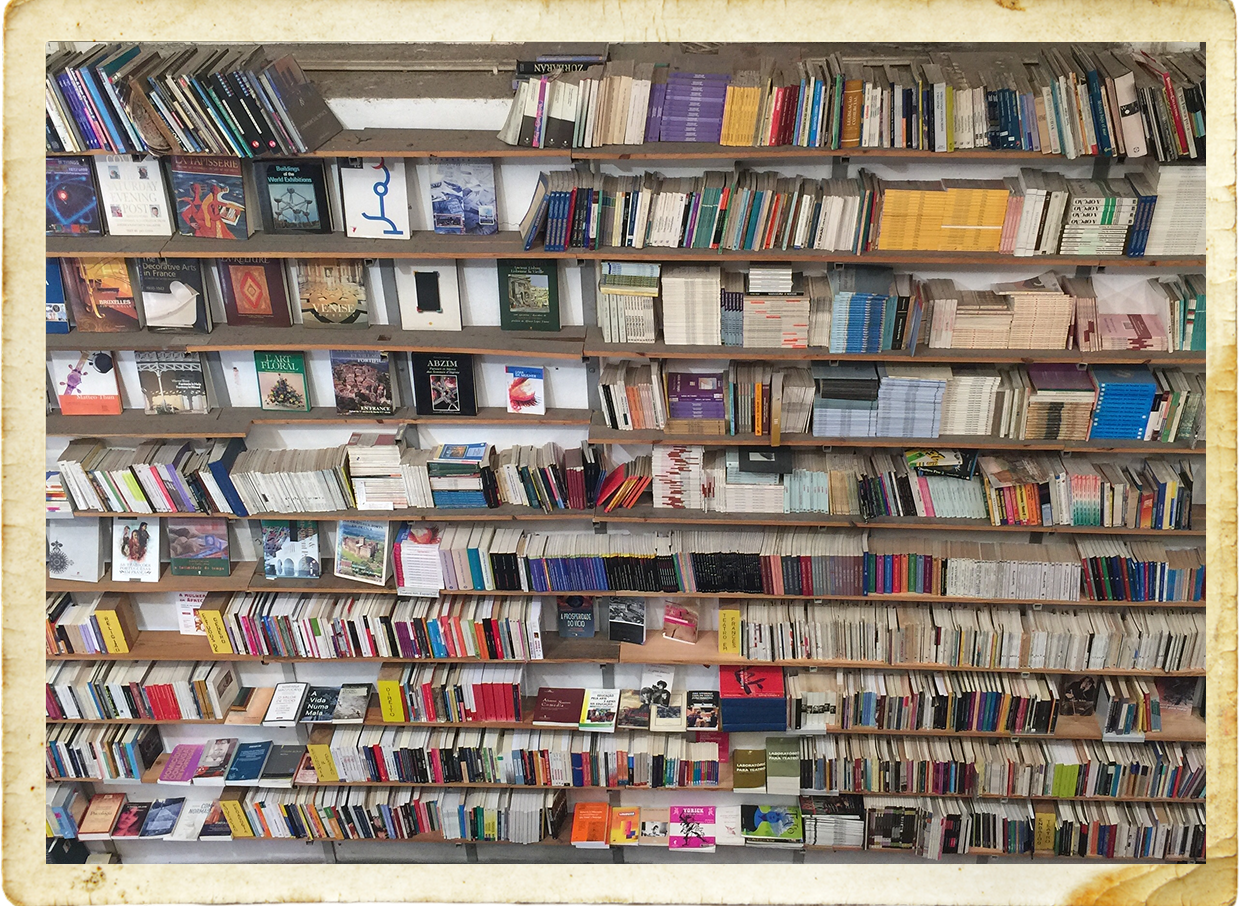 Bookshelf filled with various colorful books.
