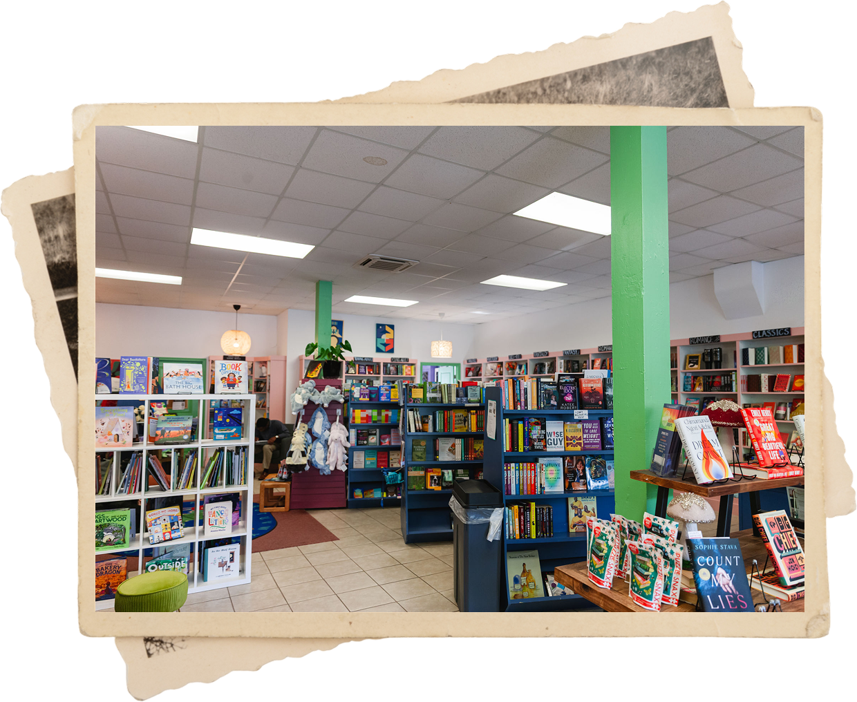 Colorful bookstore interior with shelves of books.